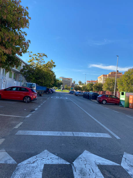 A street with a blue sky in the background