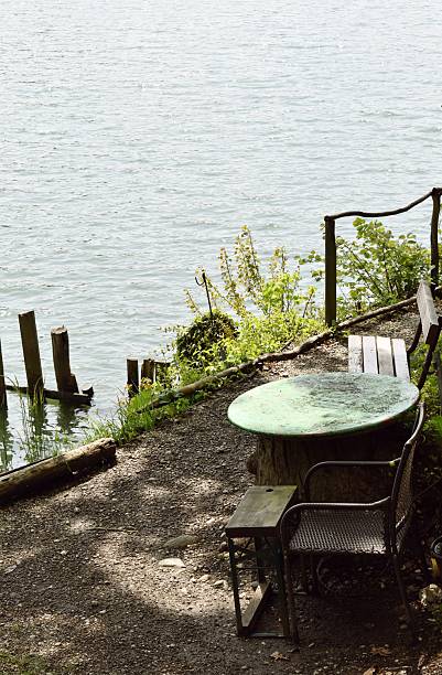 Europe, Slovenia, River Drava, spring time, river bank, table with chair and bench