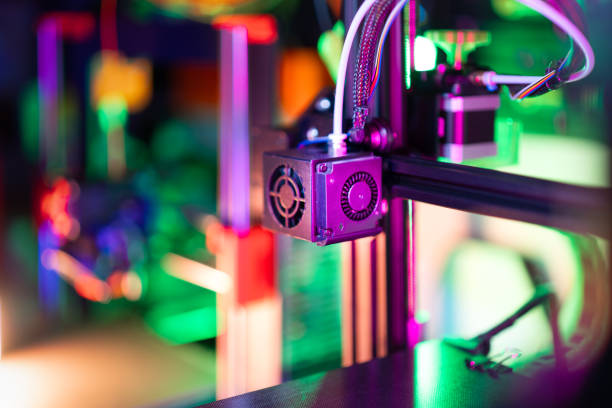 istock 3d printer home factory workshop colorful neon light 2199392069