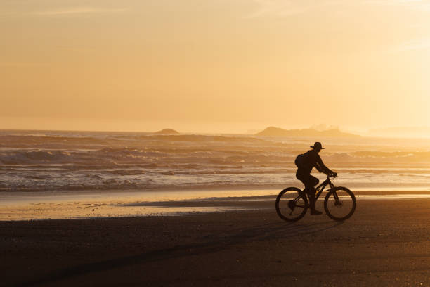 istock Tofino Long Beach Sunset Bike Ride 2199392321