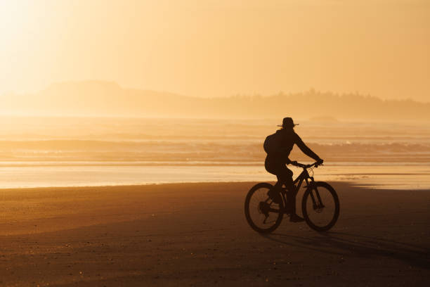 istock Tofino Long Beach Sunset Bike Ride 2199392347