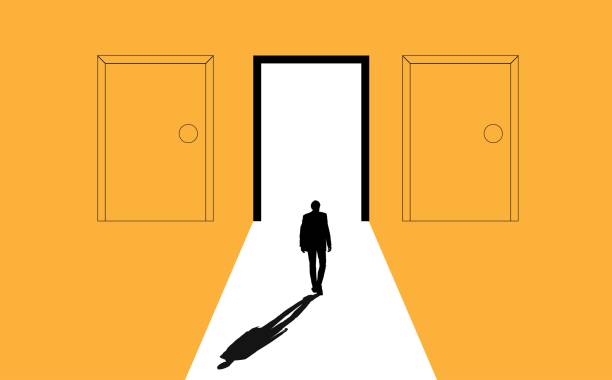 istock Silhouette of Business Man Entering an Open Door 2199392473