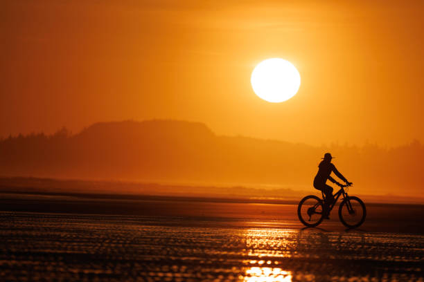 istock Tofino Sunset Bike Ride on Long Beach 2199393619