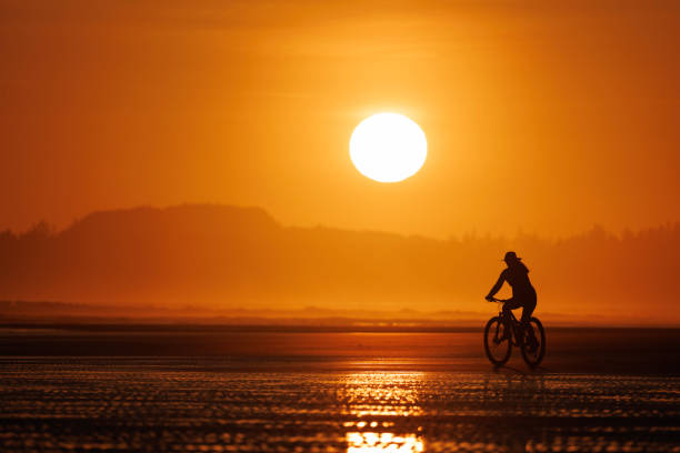 istock Tofino Sunset Bike Ride on Long Beach 2199393632