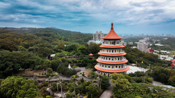 istock Buddhist temple amidst lush greenery in Taiwan during cloudy weather 2199394569
