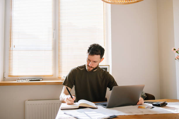 istock Online Banking: military man manage his finances at home 2199394729