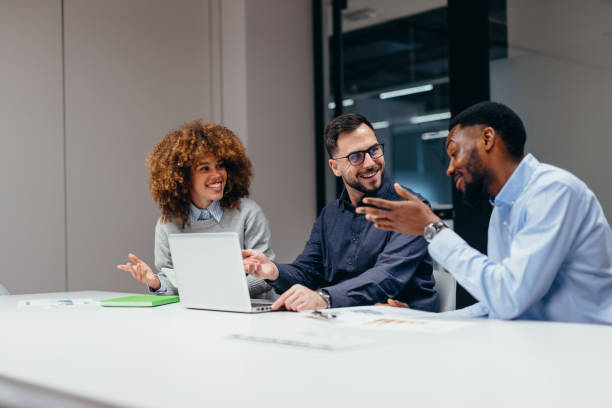 istock Business team discussing a project using a laptop in the office 2199394847