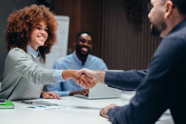 Business partners shaking hands during a meeting