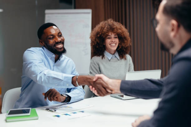 istock Business people shaking hands during a meeting in the office 2199394930