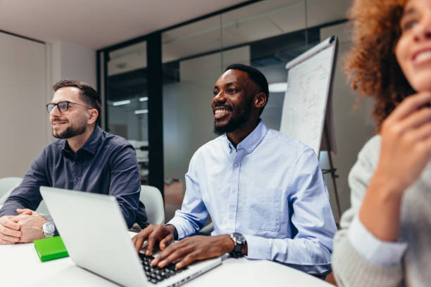 istock Business team attending a meeting and working on a laptop 2199395137