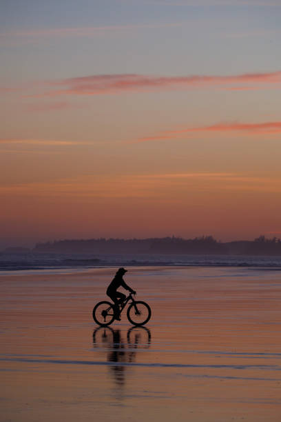 istock Sunset Tofino Bike Ride along Long Beach 2199395401
