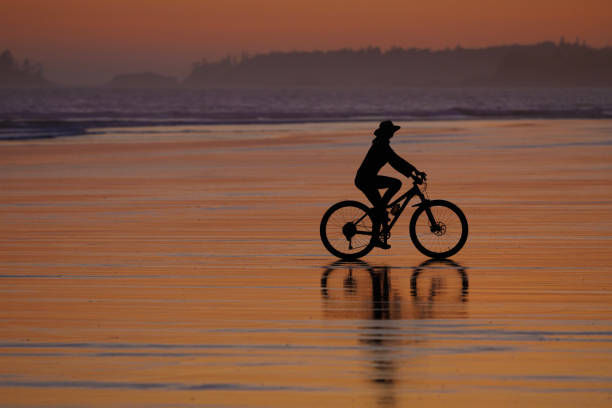 istock Sunset Tofino Bike Ride along Long Beach 2199395406