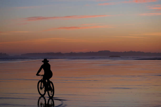 istock Sunset Tofino Bike Ride along Long Beach 2199395407
