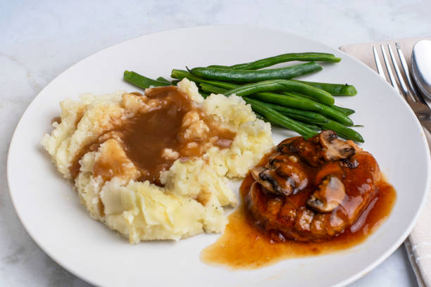 istock salisbury steak  with  green beans and mash potatoes 2199396593