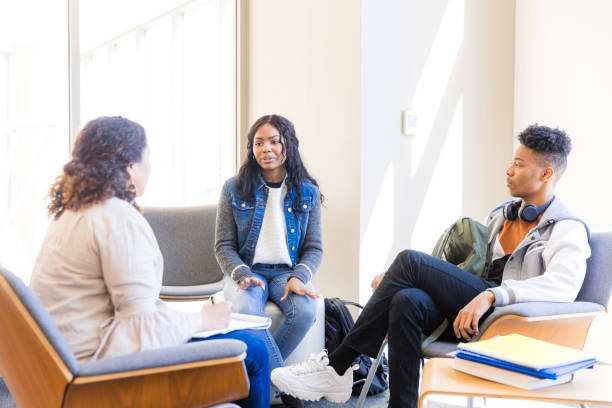 istock Group Therapy Session: Young Adults Discussing Mental Health 2199398222