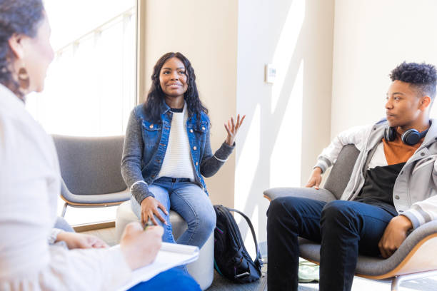 istock Group Therapy Session: Young Adults Discussing Mental Health 2199398226