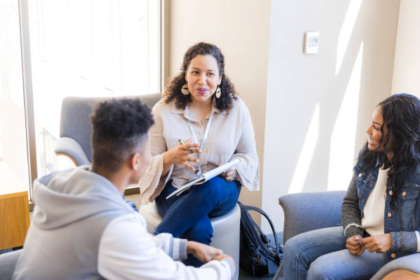 istock Group Therapy Session: Diverse Students Discussing Mental Health 2199398234