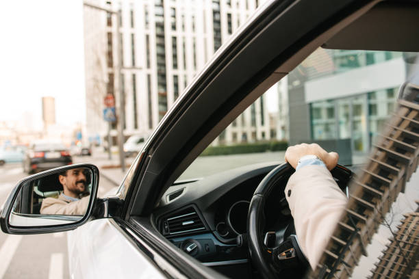 istock Businessman behind the wheel 2199400602