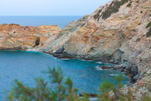 Landscape of Crete island. Rocks on the seashore. View of the Cretan Sea. The beach of Made near famous resort of Agia Pelagia, Ligaria, Heraklion, Greece.