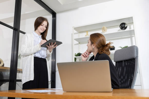 istock Business colleagues discussing strategies in a modern office 2199403010