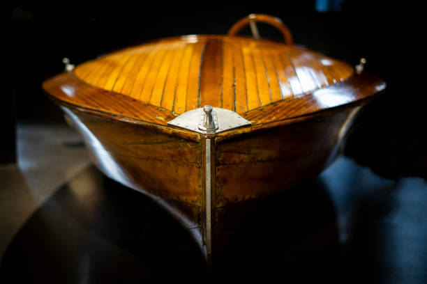 istock Classic wooden motorboat with polished deck on black background 2199403916