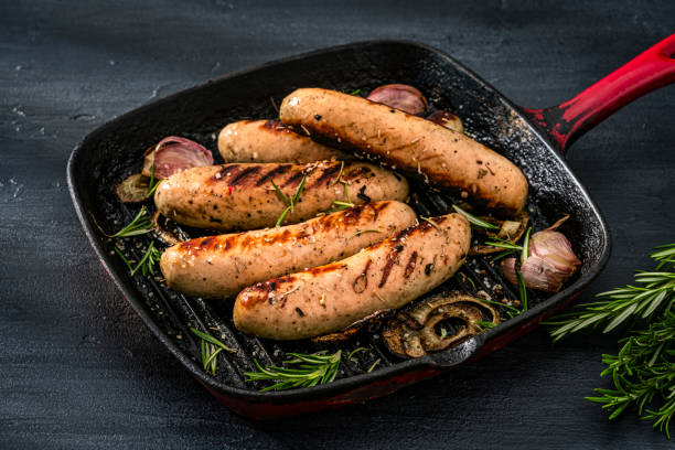 istock Cooked German Bratwurst sausages in a grill pan 2199404691