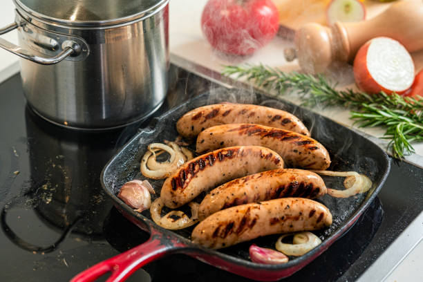 Cooking sausages in a grill pan at home