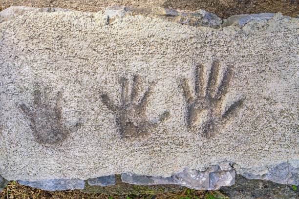 istock Children's handprints on old concrete pavement 2199409184