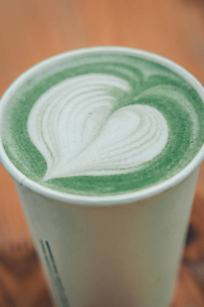 istock Matcha latte green with milk foam in paper coffee cup 2199413138