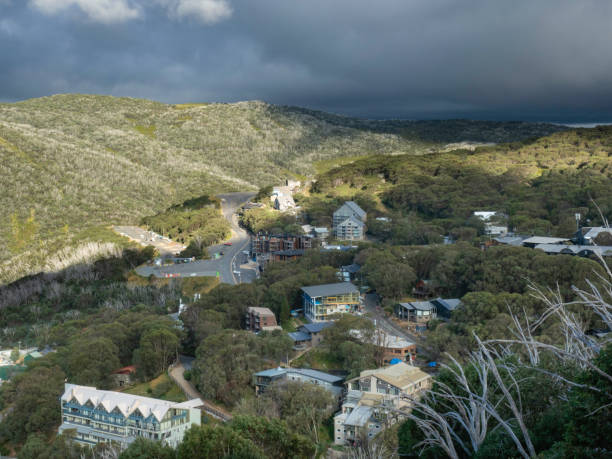 istock Looking down on alpine village with storm clouds in the background 2199414472