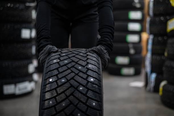 istock Mechanic keeps new studded car tires in garage. 2199414642