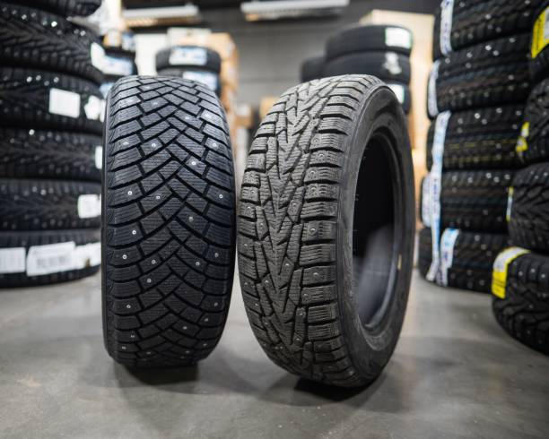 istock Comparison of old and new studded car tires. 2199415394