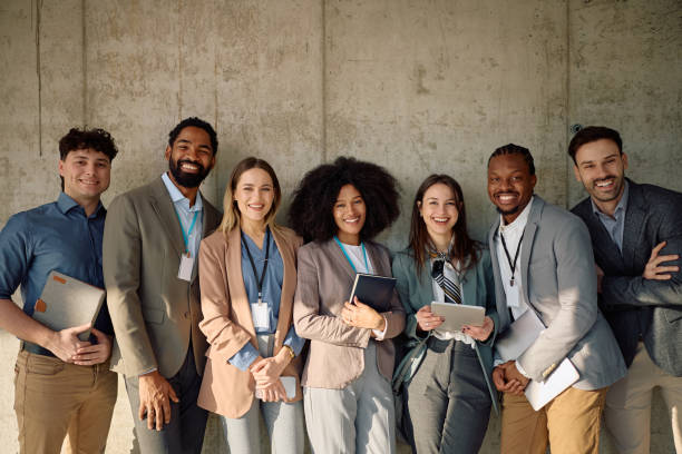 istock Multiracial business team against the wall looking at camera. 2199415435