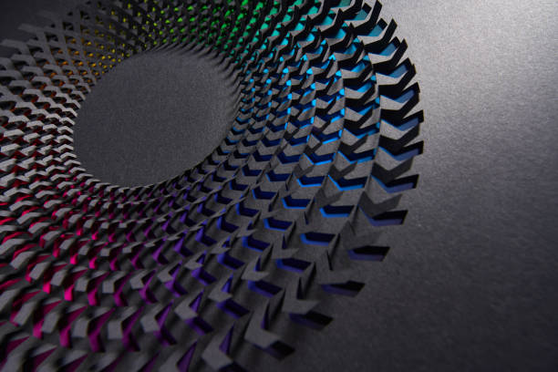 istock Intricate cut-paper artwork with layered arrow patterns and multicolored lighting on a dark background 2199415654