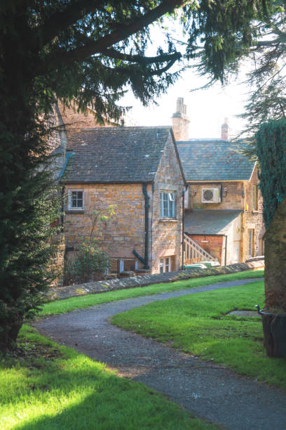 istock Winding path through charming cotswolds village in england 2199415923