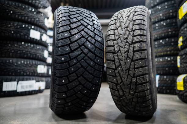 istock Comparison of old and new studded car tires. 2199417082
