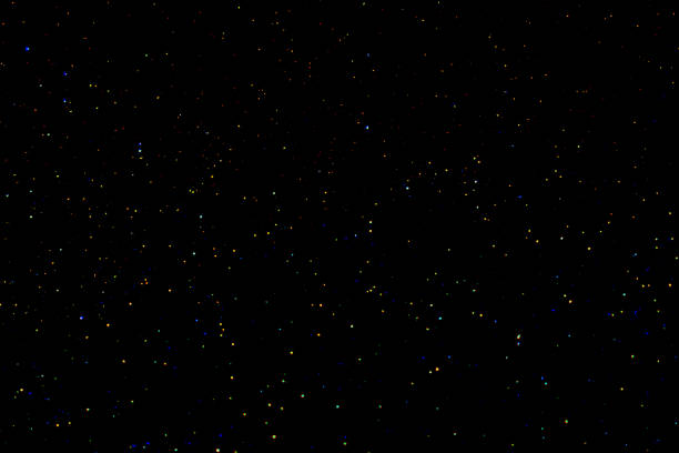Starry night sky. Glowing colourful stars in space. Galaxy background. New Year, Christmas and Celebration concept.