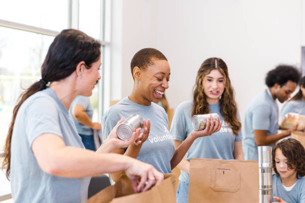 istock Volunteers Sorting Food Donations at Community Center 2199422941