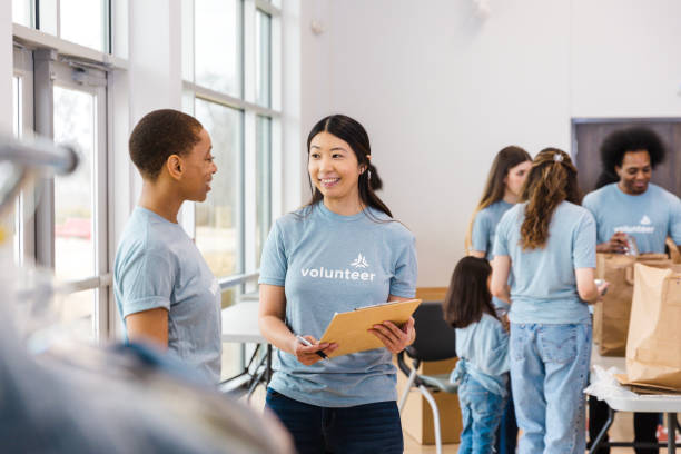 istock Volunteers working together at a community center 2199422958