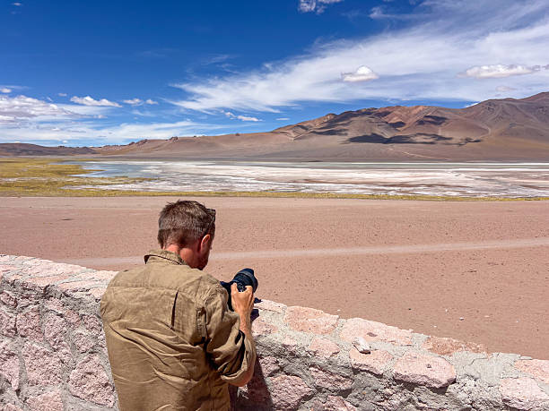 istock Photographer Capturing Scenic Desert Landscape 2199427125