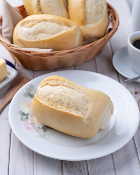 istock French bread or salt bread with butter and coffee over white wooden table 2199429226