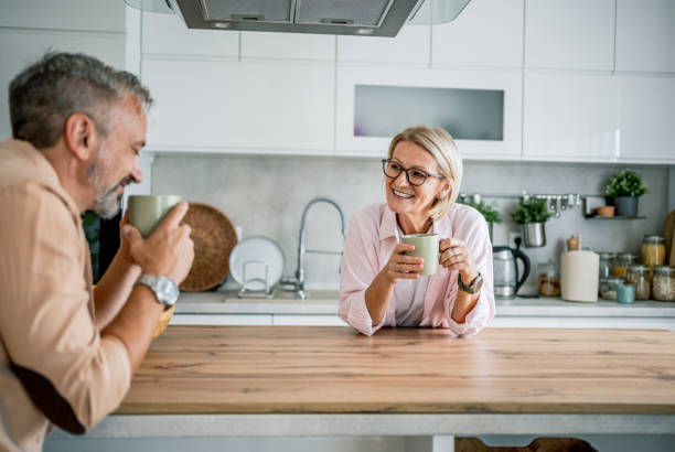 istock Mature couple enjoying the morning together 2199430736
