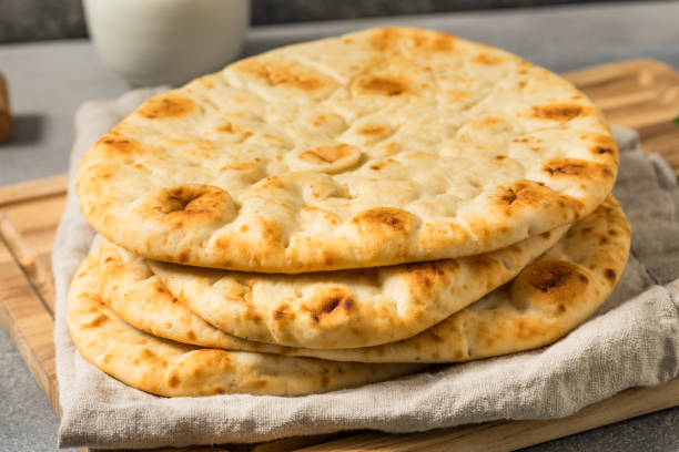 istock Homemade Warm Buttery Indian Naan Bread 2199430775