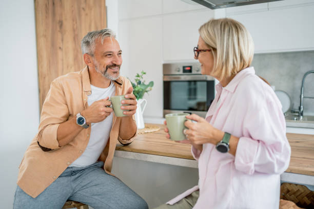 istock Mature couple chatting and drinking coffee in the morning 2199430791