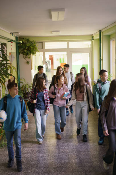 istock Boys and girls walking in the school 2199431196
