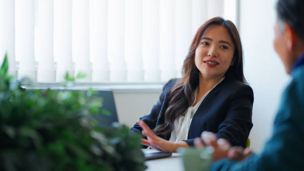 istock Businesswoman Discussing Ideas in a Sustainable Office 2199436295