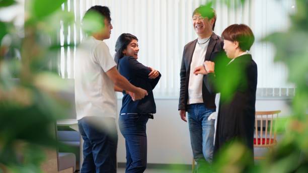 Business Team Relaxing and Socializing in a Green Office