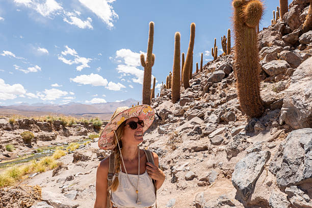 istock Woman Hiking Through Desert Landscape with Cacti 2199436439