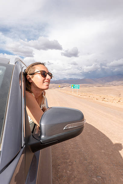 istock Woman Enjoying Scenic Desert Drive 2199437303