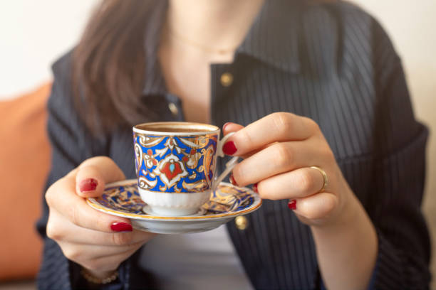 istock A woman holding a cup of Turkish coffee 2199441362